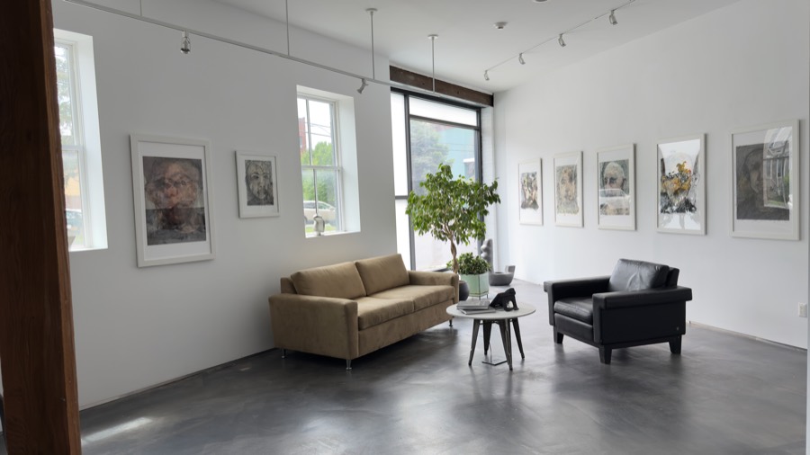 Gallery lounge with sofas and large window