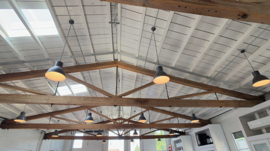 Timber king-post trusses and pendant lights